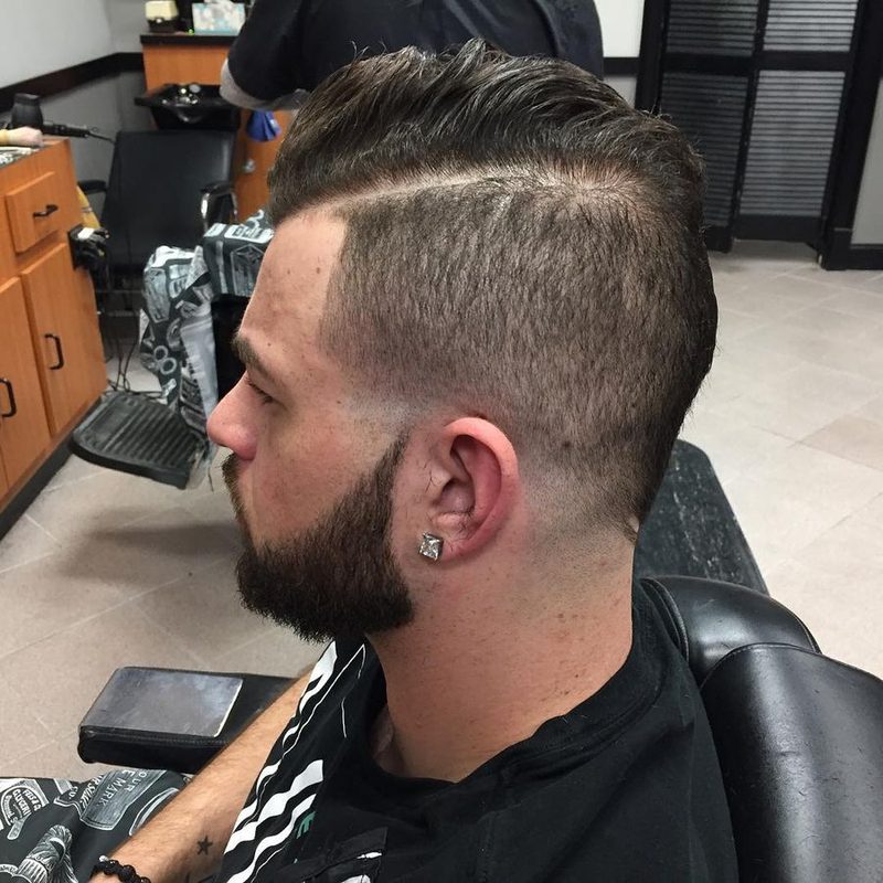 Side part with a hard part and beard.